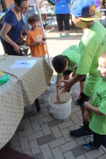 Audobon Center display - boys catching whirlybug beeles in a bucket EDA 2017