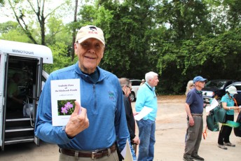 Dr. Ken Perrine with a copy of his book, Trailside Flora of Hitchcock Woods, EDA 2023